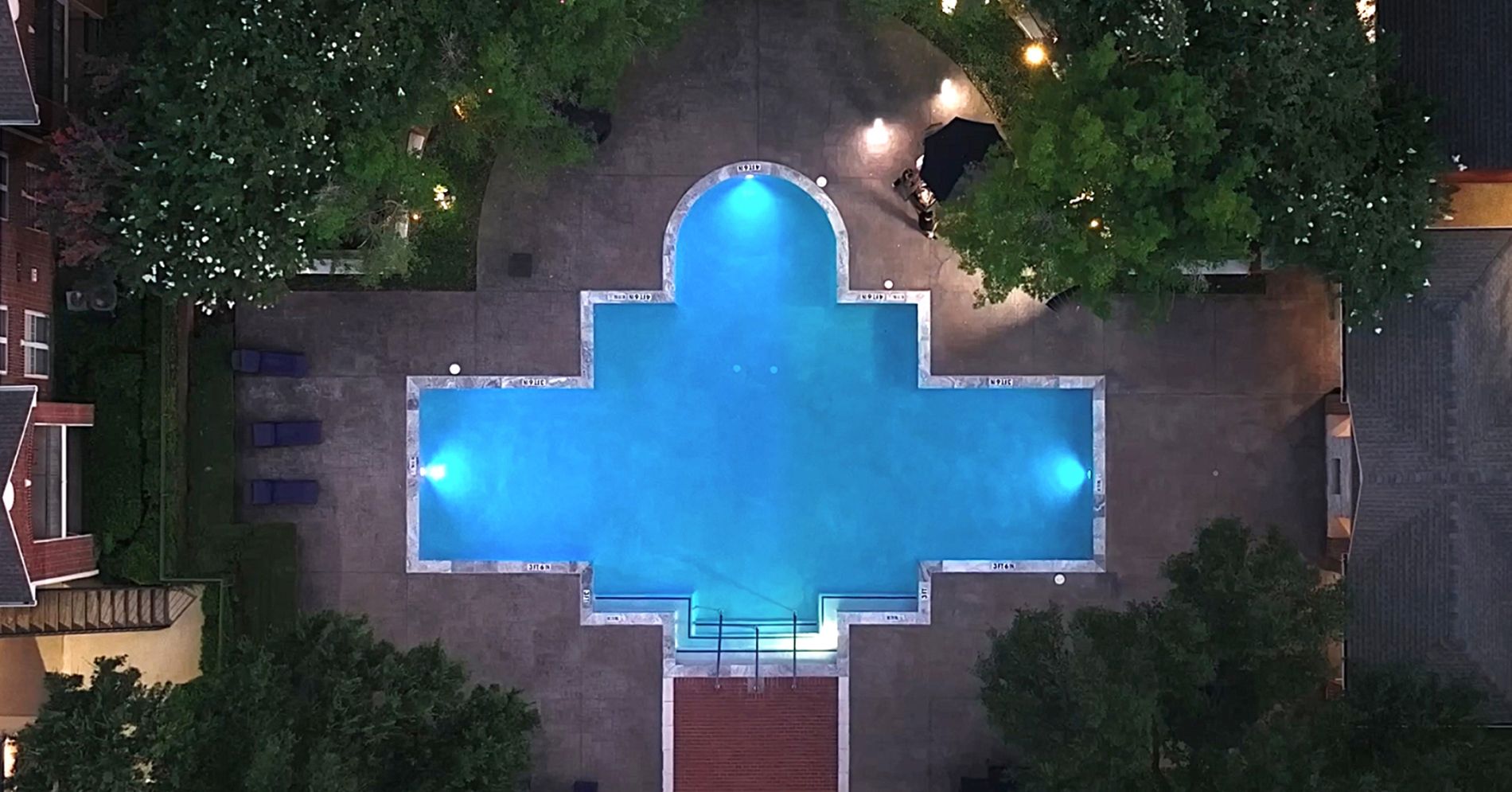 lit outdoor pool at night