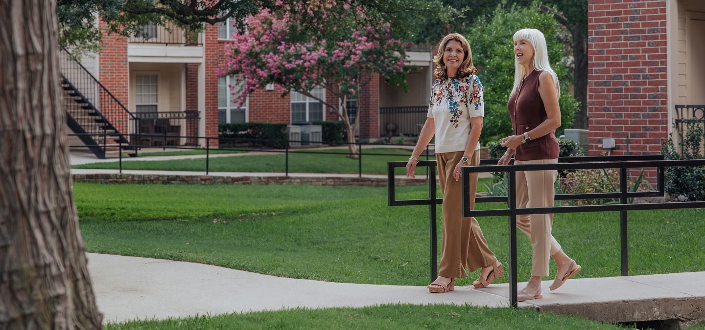 senior friends walking outdoors
